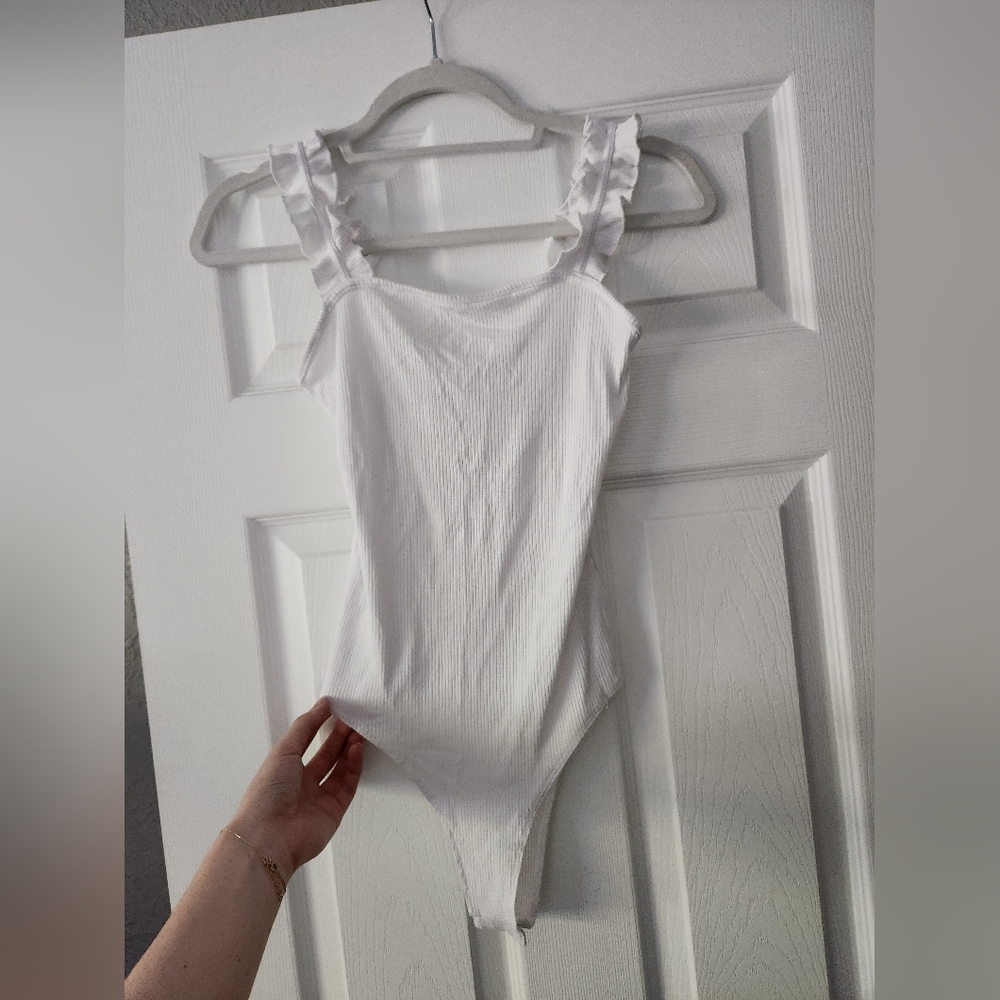 White bodysuit with ruffle straps
